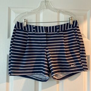 Women’s Nike Golf Shorts, size 6, navy blue with white stripes.